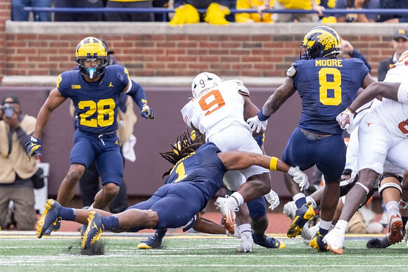 Quinten Johnson (28), Jaishawn Barham (1), and Derrick Moore (8)