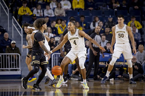 Roddy Gayle Jr. (11), Nimari Burnett (4), and Vladislav Goldin (50)