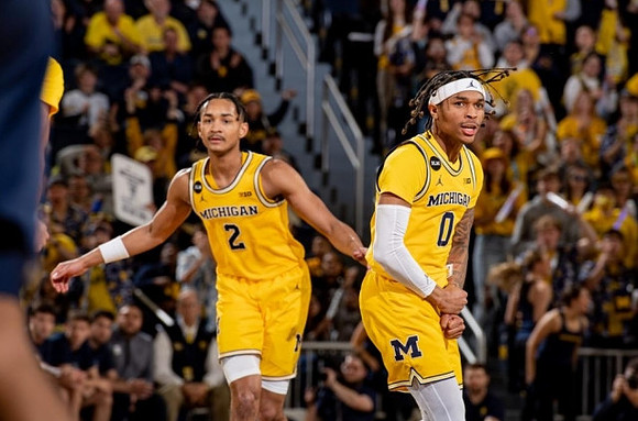 Kobe Bufkin (2) and Dug McDaniel (0)
