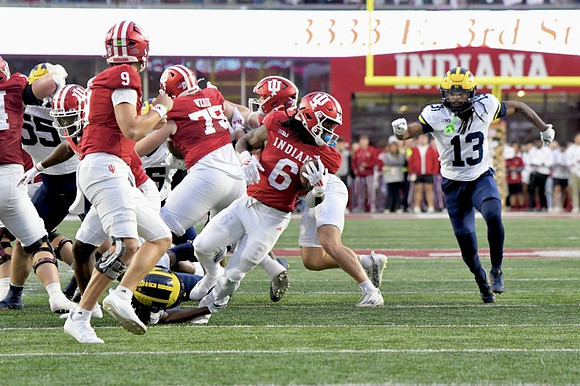 Mason Graham (55) and Wesley Walker (13)