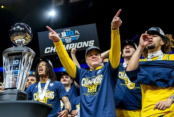 Dusty May, Michigan Team, and Big Ten Tournament Championship Trophy