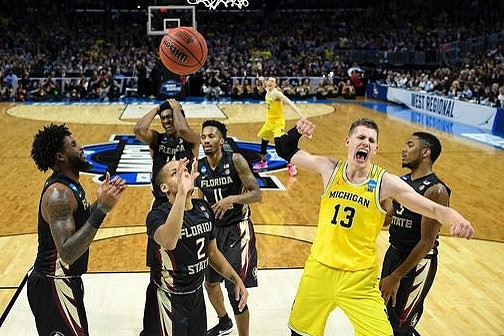 Moritz Wagner (13) and Duncan Robinson (22)
