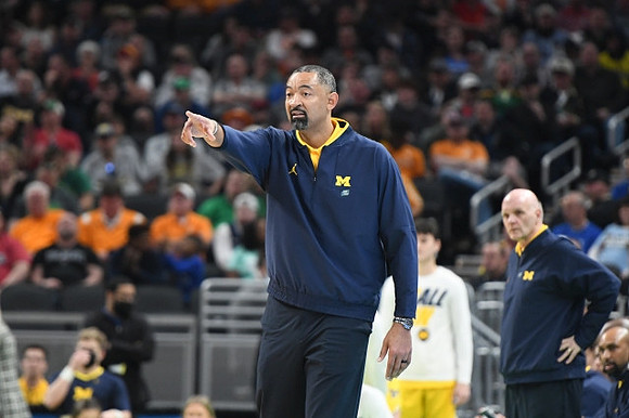 Juwan Howard and Phil Martelli