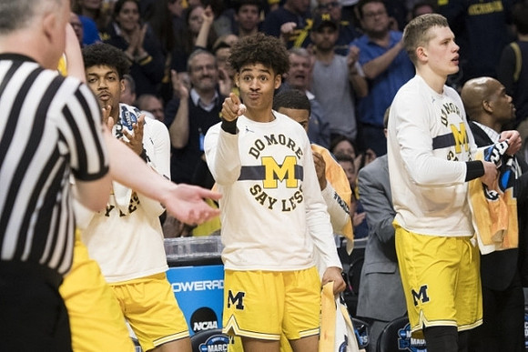 Ibi Watson (23), Jordan Poole (2), Moritz Wagner (13), and Deandre Haynes