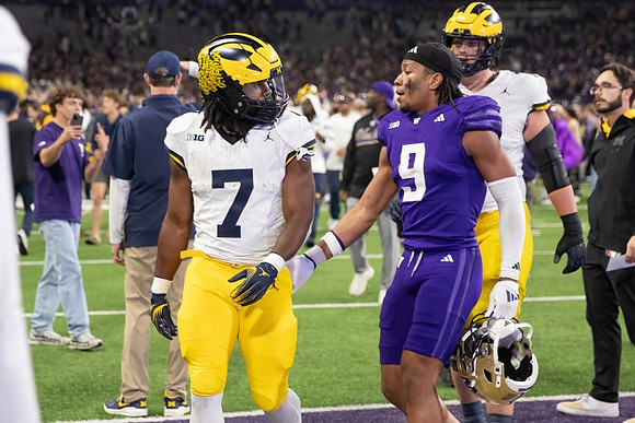 Donovan Edwards (7) and Evan Link (71)