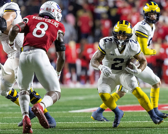 Blake Corum (2) and J.J. McCarthy (9)