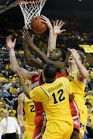 Duncan Robinson (22), Muhammad-Ali Abdur-Rahkman (12), and Mark Donnal (34)