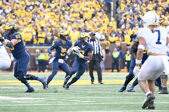 Zak Zinter (65), Darrius Clemons (0), Donovan Edwards (7), and Olusegun Oluwatimi (55)