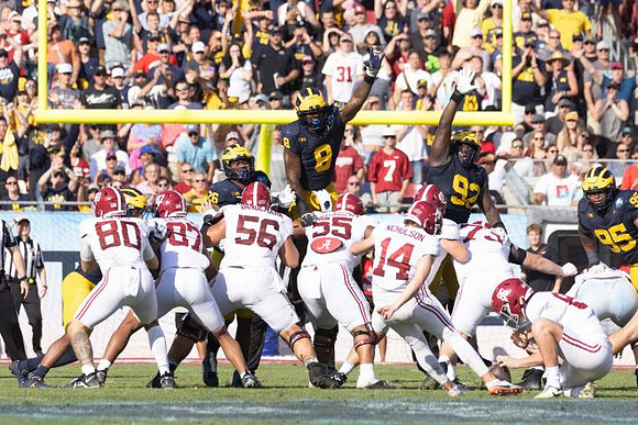 Rayshaun Benny (26), Derrick Moore (8), Ike Iwunnah (92), and Trey Pierce (95)