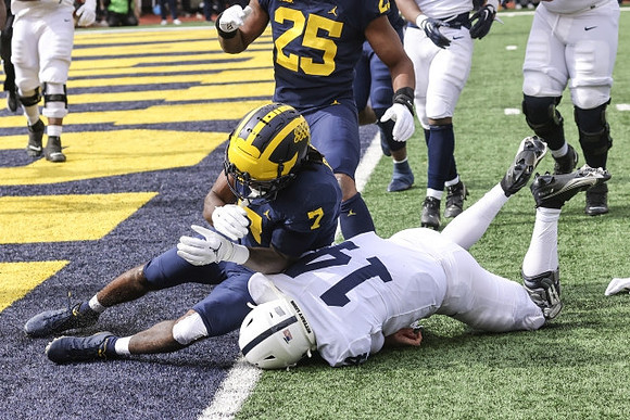 Makari Paige (7) and Junior Colson (25)