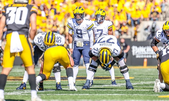 Olusegun Oluwatimi (55), J.J. McCarthy (9), Donovan Edwards (7), Trevor Keegan (77), and Ryan Hayes (76)