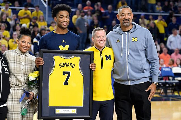 Jace Howard (7), Dusty May, and Juwan Howard