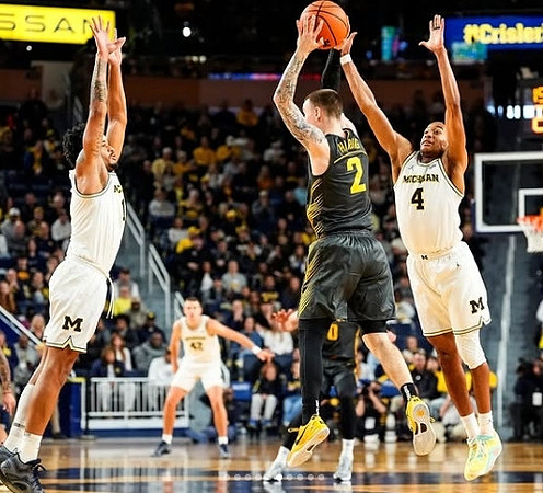 Roddy Gayle Jr. (11), Will Tschetter (42), and Nimari Burnett (4)