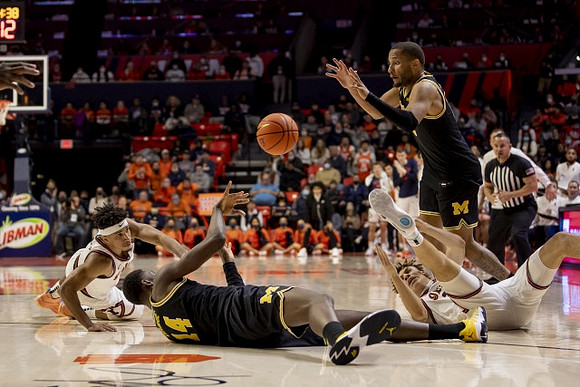 Moussa Diabate (14) and DeVante' Jones (12)