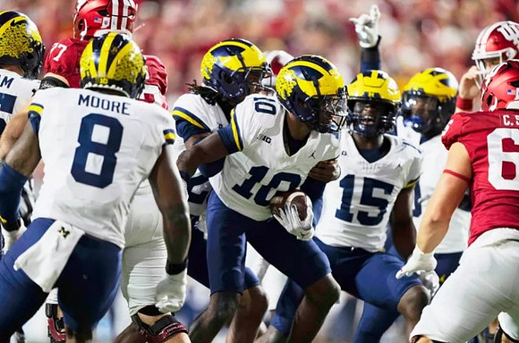 Derrick Moore (8), Zeke Berry (10), and Ernest Hausmann (15)