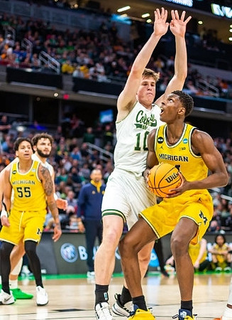 Moussa Diabate (14) and Eli Brooks (55)