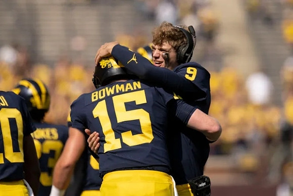 Alan Bowman (15) and J.J. McCarthy (9)