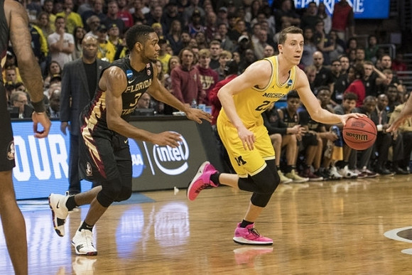 Duncan Robinson (22) and Florida State Head Coach Leonard Hamilton