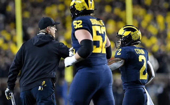 Jim Harbaugh, Karsen Barnhart (52), and Blake Corum (2)