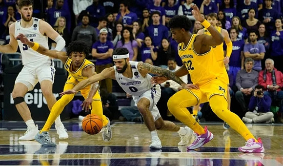 Kobe Bufkin (2), Tarris Reed Jr. (32), and Joey Baker (15)