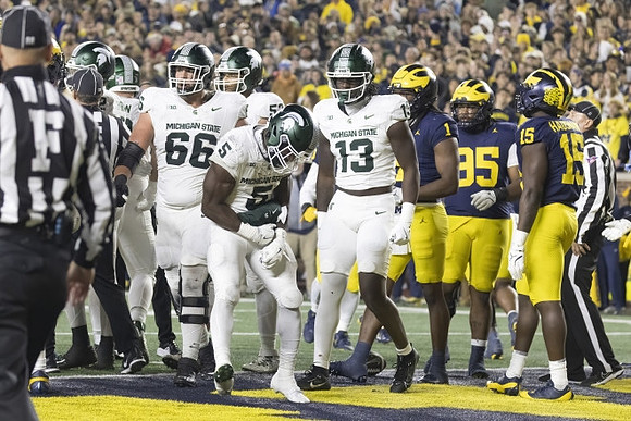 Jaishawn Barham (1), Trey Pierce (95), and Ernest Hausmann (15)
