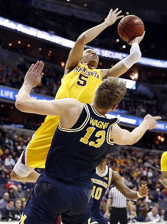 Moritz Wagner (13) and Derrick Walton Jr. (10)