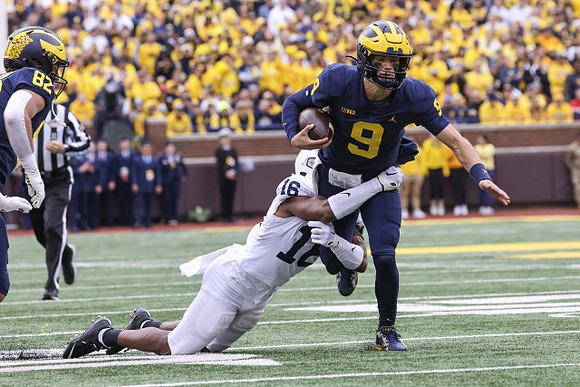 Max Bredeson (82) and J.J. McCarthy (9)
