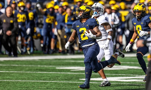 Blake Corum (2) and Ronnie Bell (8)