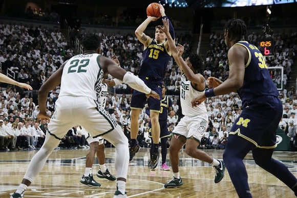 Joey Baker (15) and Tarris Reed Jr. (32)