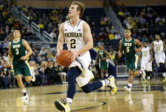 Spike Albrecht (2), Derrick Walton Jr. (10), and Zak Irvin (21)