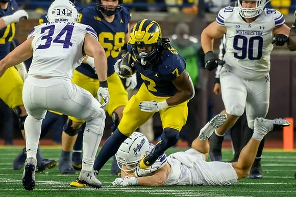 Donovan Edwards (7) and Josh Priebe (68)