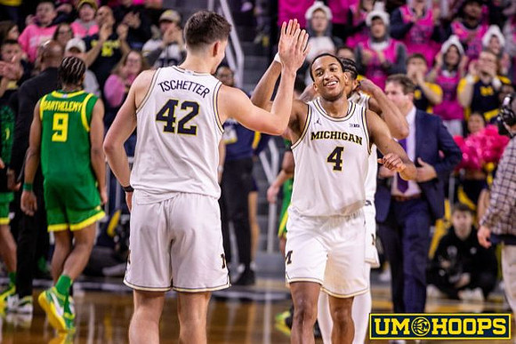 Will Tschetter (42) and Nimari Burnett (4)