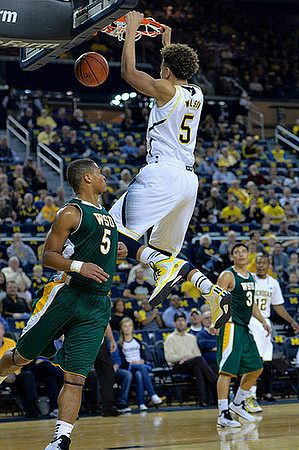 D.J. Wilson (5) and Muhammad-Ali Abdur-Rahkman (12)
