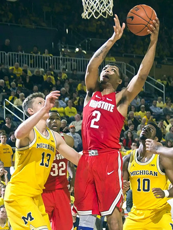 Moritz Wagner (13) and Derrick Walton Jr. (10)