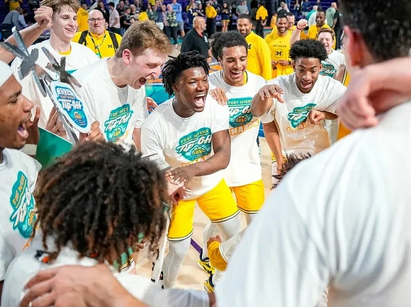 Michigan Team and Fort Myers Tip-Off Championship Trophy