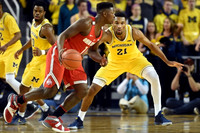 Derrick Walton Jr. (10) and Zak Irvin (21)