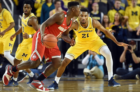 Derrick Walton Jr. (10) and Zak Irvin (21)