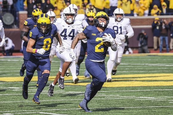 Olusegun Oluwatimi (55), Ronnie Bell (8), and Blake Corum (2)