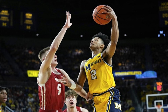 Kobe Bufkin (2) and Tarris Reed Jr. (32)