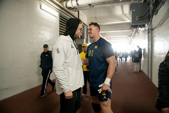Aidan Hutchinson and Luke Schoonmaker (86)