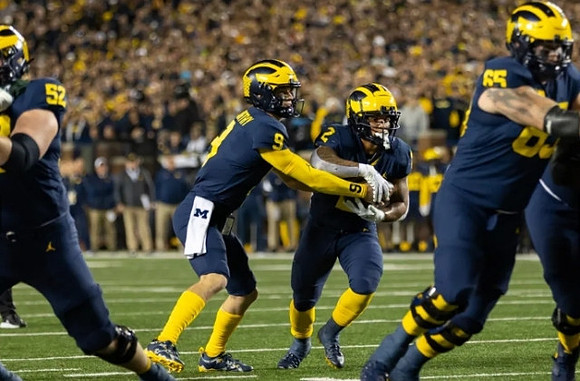 Karsen Barnhart (52), J.J. McCarthy (9), Blake Corum (2), and Zak Zinter (65)