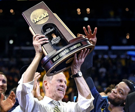 John Beilein, Zavier Simpson (3), and West Regional Championship Trophy