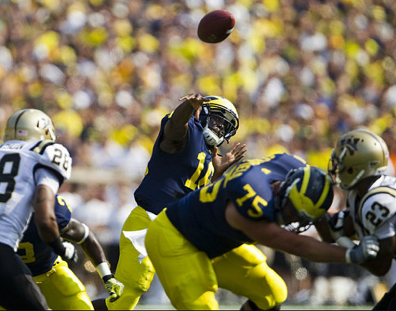 Denard Robinson (16) and Michael Schofield (75)