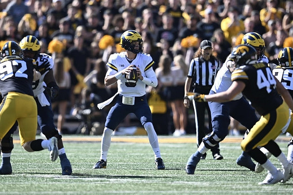 Trente Jones (53) and J.J. McCarthy (9)
