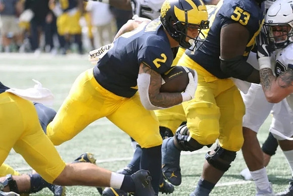 Blake Corum (2) and Trente Jones (53)