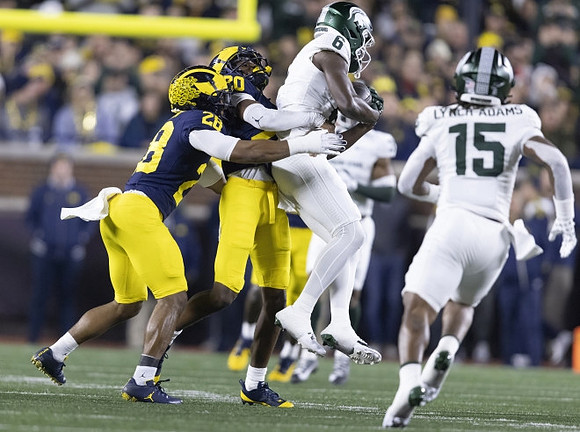 Quinten Johnson (28) and Jyaire Hill (20)