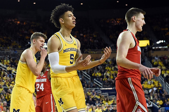 Moritz Wagner (13) and D.J. Wilson (5)