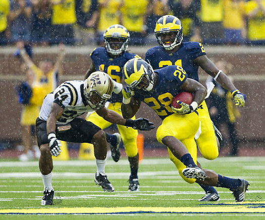 Fitzgerald Toussaint (28), Junior Hemingway (21), and Denard Robinson (16)