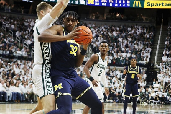 Tarris Reed Jr. (32) and Dug McDaniel (0)