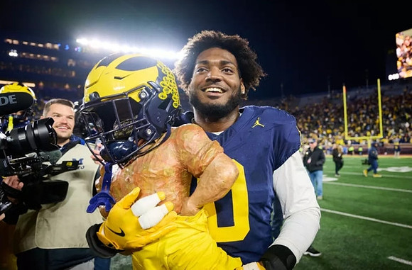 Josaiah Stewart (0) and Paul Bunyan Trophy